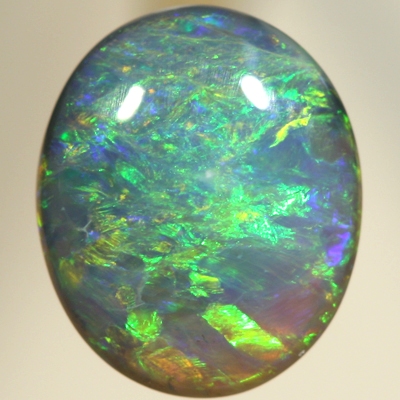 SOLID BLACK OPAL Bright orange and green over a blue background. SEE VIDEO